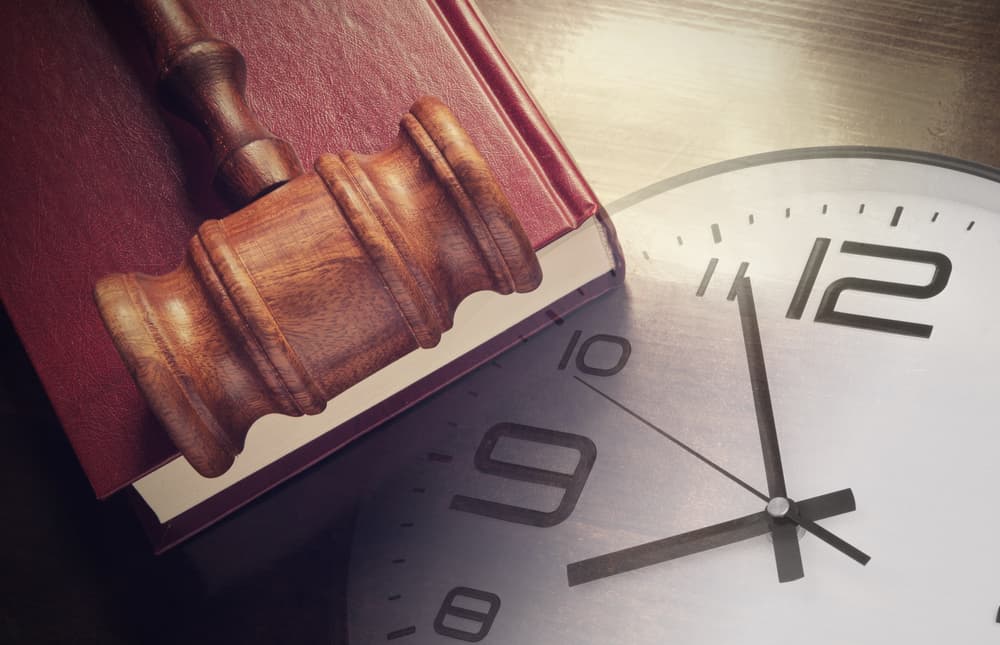 Wall Clock with a book and judge's gavel